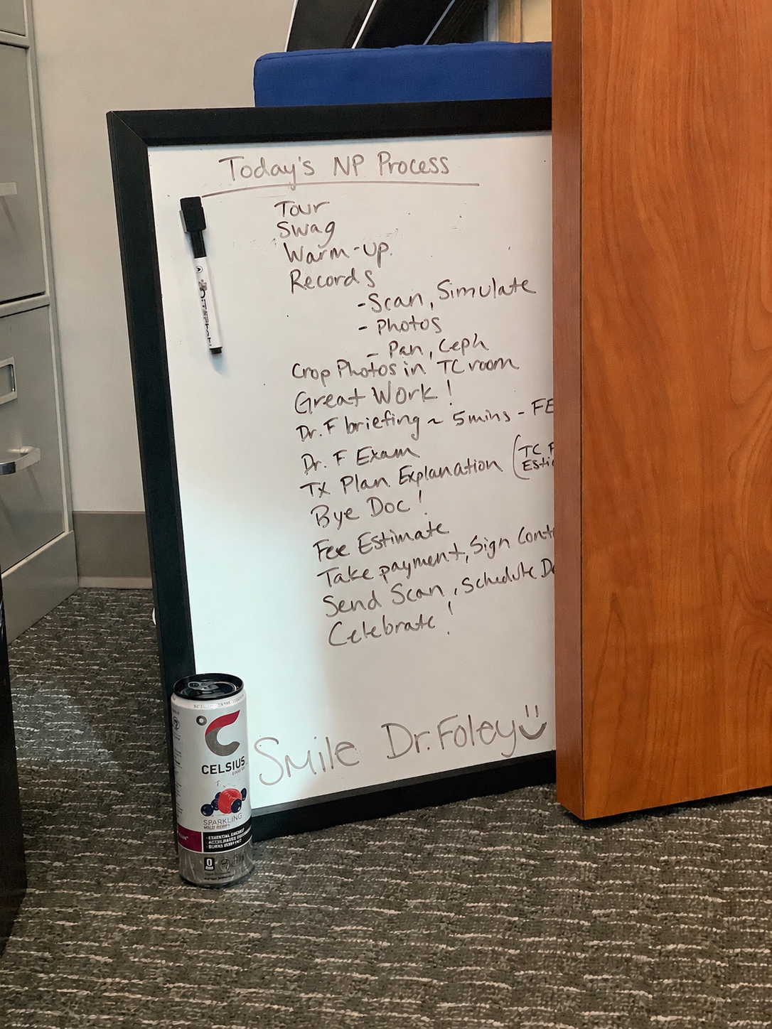Dr. Foley's whiteboard mapping the New Patient Process: Tour, Swag, Warm-Up, Records, Photos, Pan/Ceph, Dr. Briefing, Dr. Exam, Tx Plan, Fee Estimate, Sign Contract, Celebrate.