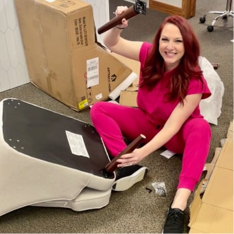 One of our Stray Consulting members assembling an armchair in an office