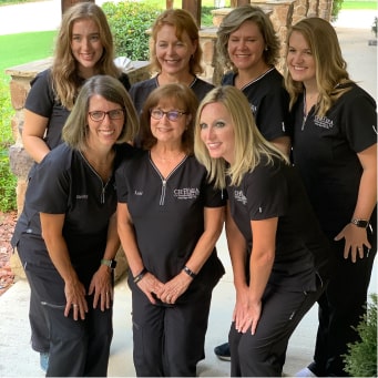 Orthodontic female team smiling in group